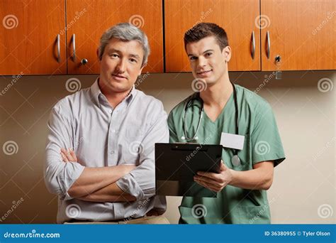 Medical Resident with Doctor Stock Image - Image of mature, coworker: 36380955