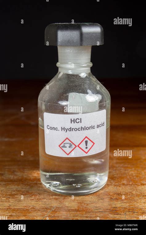 A bottle of concentrated hydrochloric acid (HCl) as used in a UK secondary school, London, UK ...