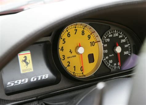 Ferrari_yellow_speedometer - Stables Motor Condos