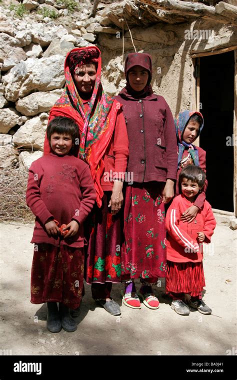 Tajik family wearing traditional dress and hat, Marguzor village Stock Photo, Royalty Free Image ...