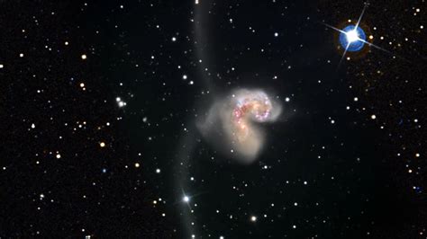 Zoom into the Antennae Galaxies - YouTube