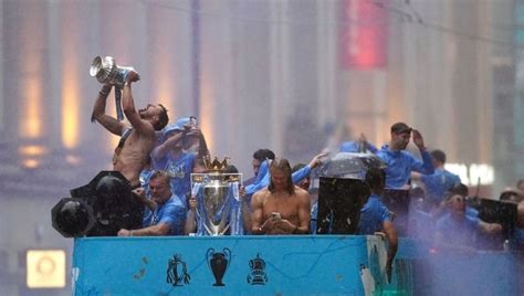 Watch: Manchester City enjoy historic treble with bus parade despite ...