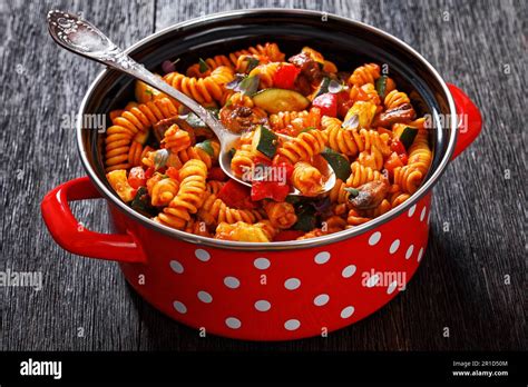 One Pot Veggie Pasta of rotini, zucchini, capsicum, mushrooms smothered in a garlic herb tomato ...