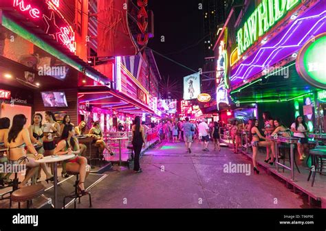 Nightlife in the red light district Soi Cowboy, girls waiting in front ...