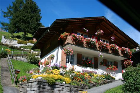 The traditional swiss chalet - The HUGE flower boxes are EXACTLY what our old house needs :) and ...