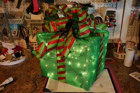 make your own lighted present decoration with chicken wire, string of ...