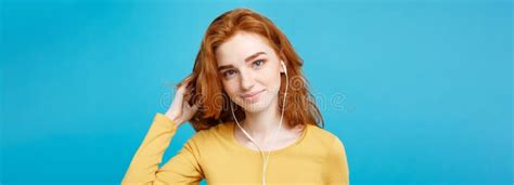 Lifestyle Concept - Portrait of Cheerful Happy Ginger Red Hair Girl Enjoy Listening To Music ...