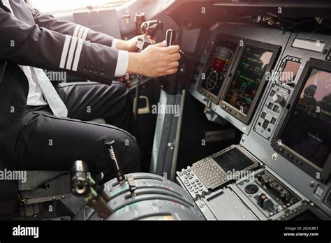 Male pilot use steering wheel to fly on airplane Stock Photo - Alamy