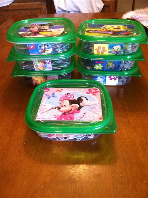 Use dollar store containers to keep kids puzzles organized. Tape picture to lid and a smaller ...