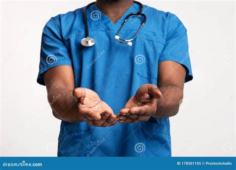 Black Doctor in Blue Uniform Giving Something To Patients Stock Image ...