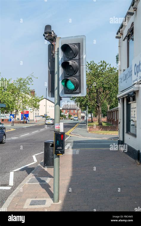 Pedestrian Puffin Crossing with traffic light on green with pedestrian sensors above the lights ...