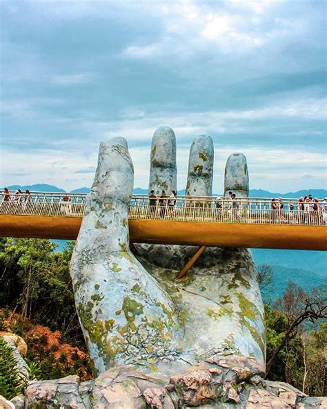 A Giant Pair of Hands Lift Vietnam's Da Nang Golden Bridge Into The Sky | artFido