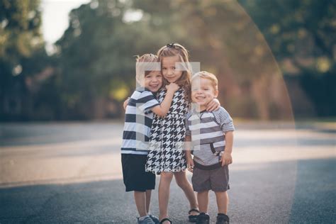 Hugging siblings — Photo — Lightstock