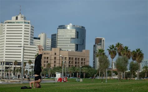 Yoga, surfing and fishing: Signs of normalcy on Tel Aviv beaches amid ...