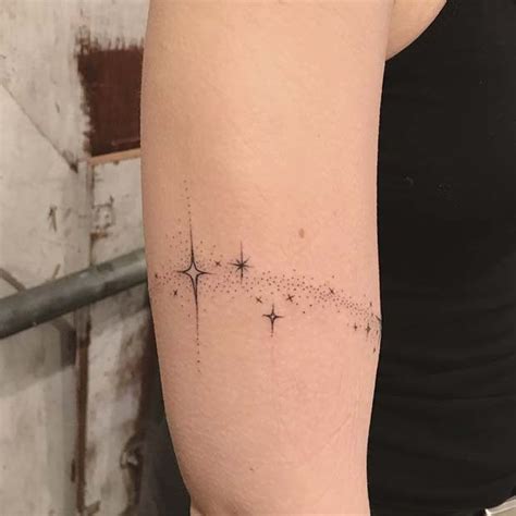 a woman with a star tattoo on her arm