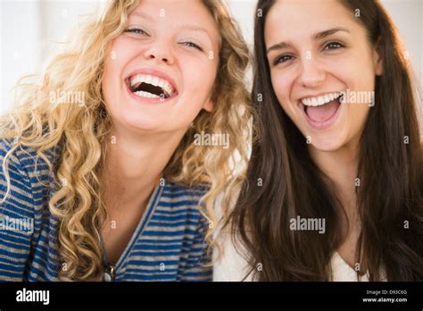 Women laughing together Stock Photo - Alamy