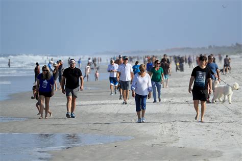 Floridians pack beaches as coronavirus cases continue to increase.