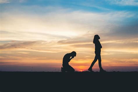 Silhouette of couple breaking up on the road at sunset 1963949 Stock Photo at Vecteezy