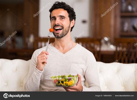 Man Eating Salad Home — Stock Photo © minervastock #188644600