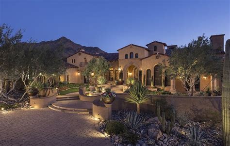 Mediterranean Luxury Home Front Exterior View of Driveway and Entry ...