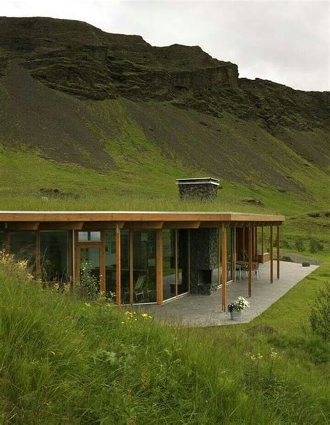 half-burried/underground house with green grass roof and preserved ...