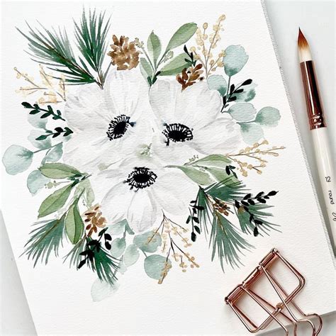 a watercolor painting of white flowers and greenery with a brush next to it