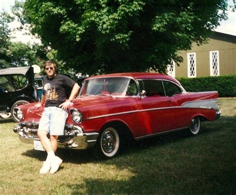 Me standing in front of my brothers classic 57 Chevy