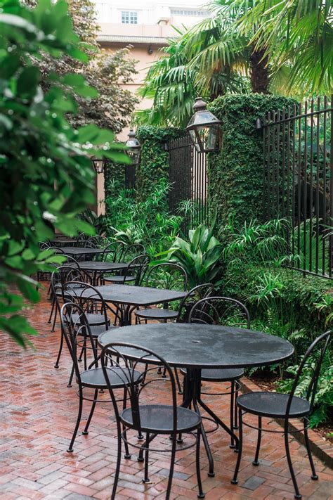 Black metal patio tables near green plants during daytime photo – Free Outdoors Image on Unsplash