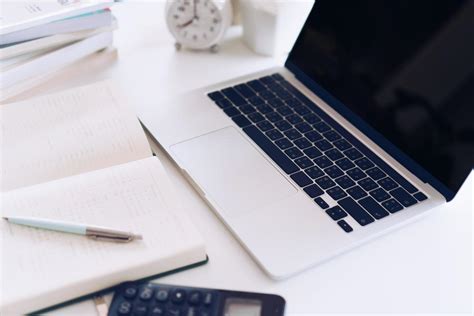 Planner notebook and laptop at workspace 2075491 Stock Photo at Vecteezy