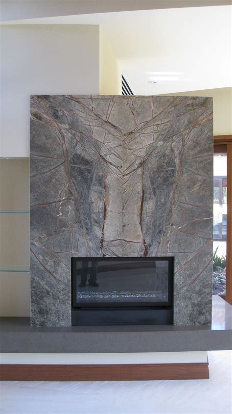 Book matched stone fireplace wall and slab stone hearth with a mitered edge. in 2019 | Natural ...