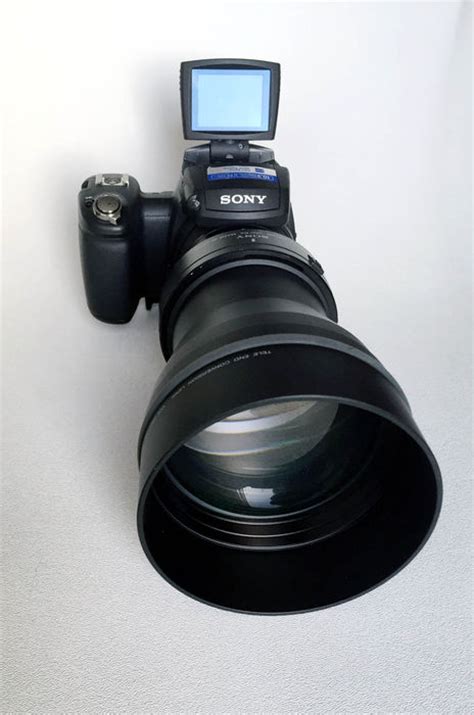 Sony Cyber-shot DSC R1 with the 1.7 telephoto end conversion lens - Catawiki