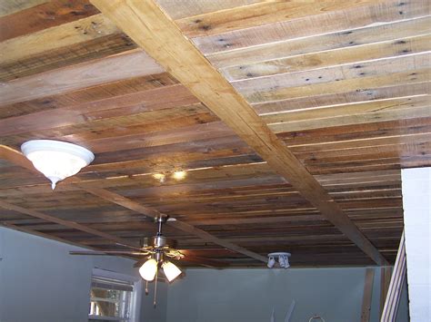 pallet wood ceiling with 1 x 6 pine boards to break up the look and give it some interest ...