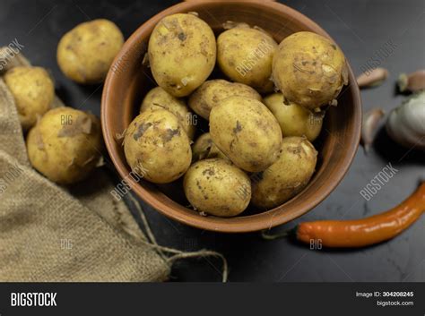 Potatoes On Black Image & Photo (Free Trial) | Bigstock