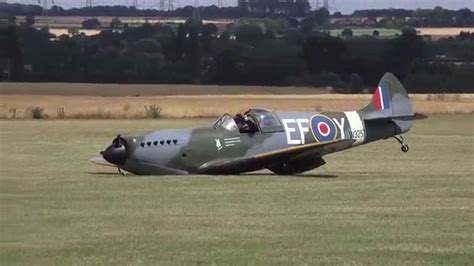 Dramatic moment a replica Spitfire lands without undercarriage - YouTube