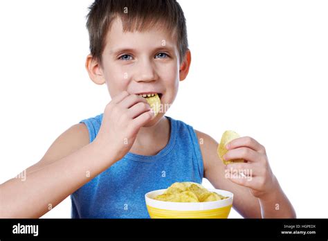 Little boy eating potato chips isolated white Stock Photo - Alamy