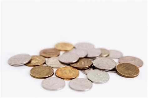 Premium Photo | A small heap of differently colored ruble coins. isolated