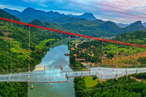 World's longest glass-bottomed bridge opens in China | Scenic, Tourism development, Glass bridge