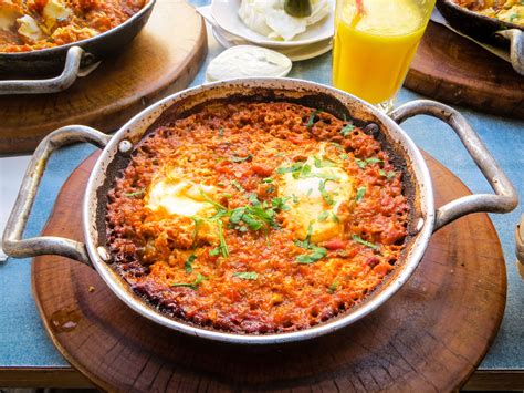 Shakshuka is a traditional Israeli breakfast dish made with tomatoes ...