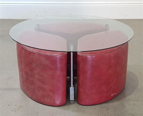 Lot - TH Brown style round glass top coffee table set, with three stools (h:38 d:80cm)