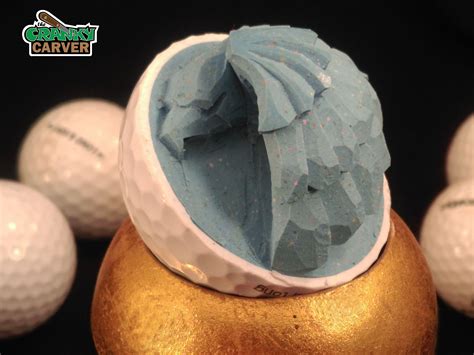 Eagle carved from the insides of standard golf ball by The Cranky Carver, on facebook and etsy ...