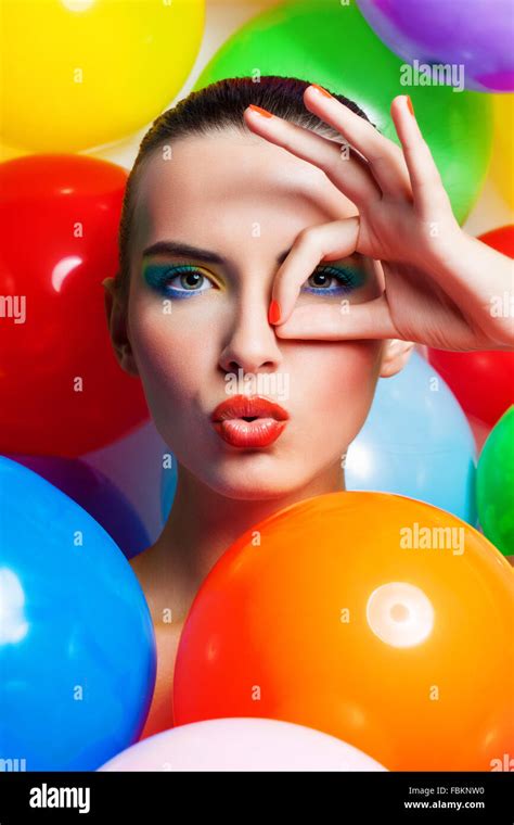 Beauty Girl Portrait with Colorful Makeup, Nail polish and Accessories. Colourful Studio Shot of ...