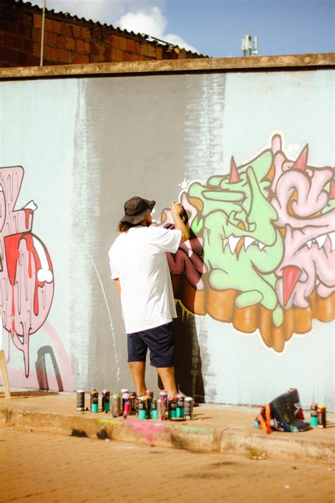 Man Painting Graffiti on a Wall · Free Stock Photo