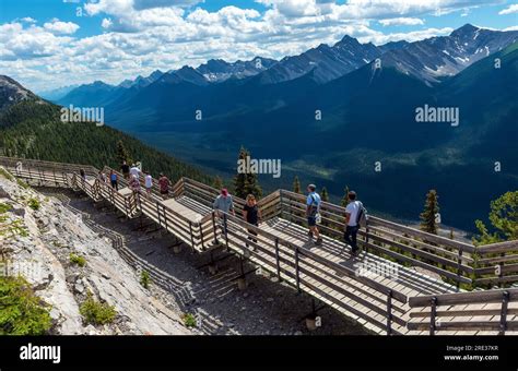 Tourists walking the Sulphur Mountain hike on elevated walkway after taking the Banff Gondola ...