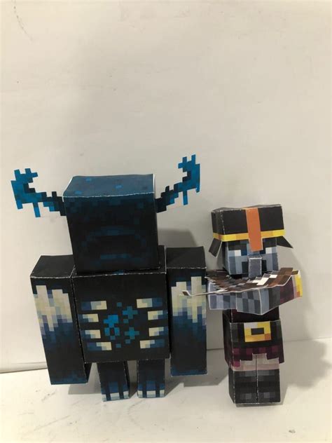 two paper toys made to look like minecraft characters