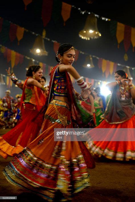 News Photo : People enjoying Garba dance in colorful...