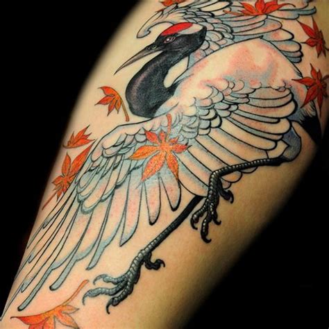 Crane tattoo meaning: sense, history, photo examples, sketches, facts