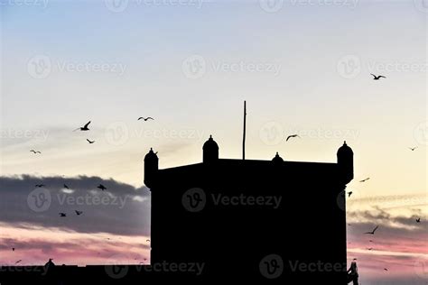 Building silhouette at sunset 14446257 Stock Photo at Vecteezy