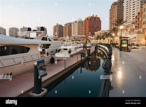 Boats moored at a marina in The Pearl-Qatar, an artificial residential ...