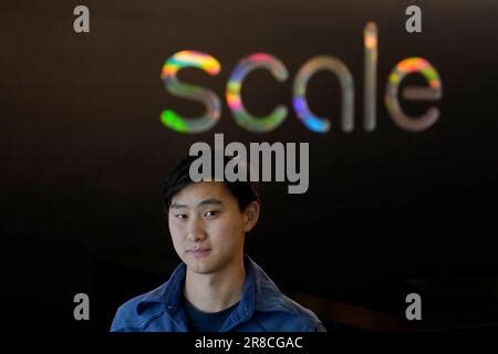 Scale AI founder and CEO Alexandr Wang poses for photos at the company's office in San Francisco ...