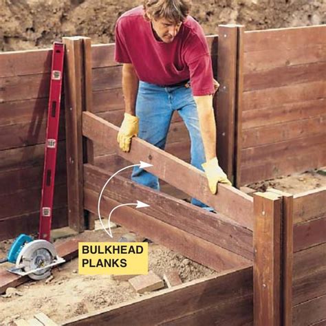 How to Build a Treated-Wood Retaining Wall | Wood retaining wall, Building a retaining wall ...